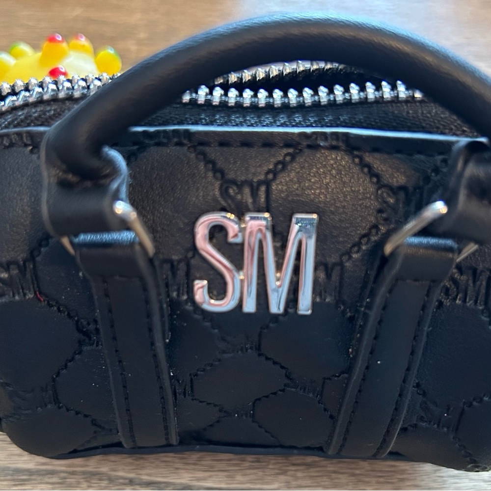 Black Quilted Women's change mini bag.